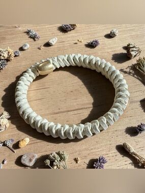 Plunder Cream Braided Leather Spring Bracelet with Gold Cap Tips